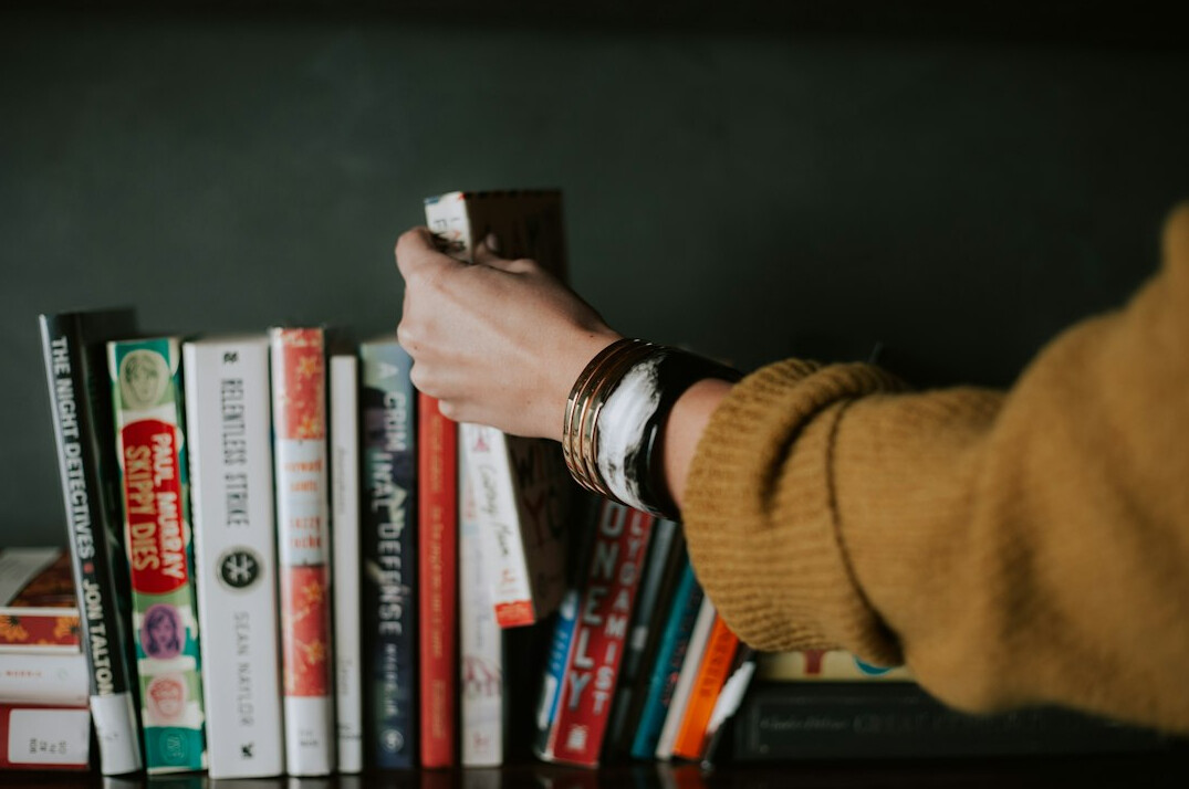 person reading mystery book