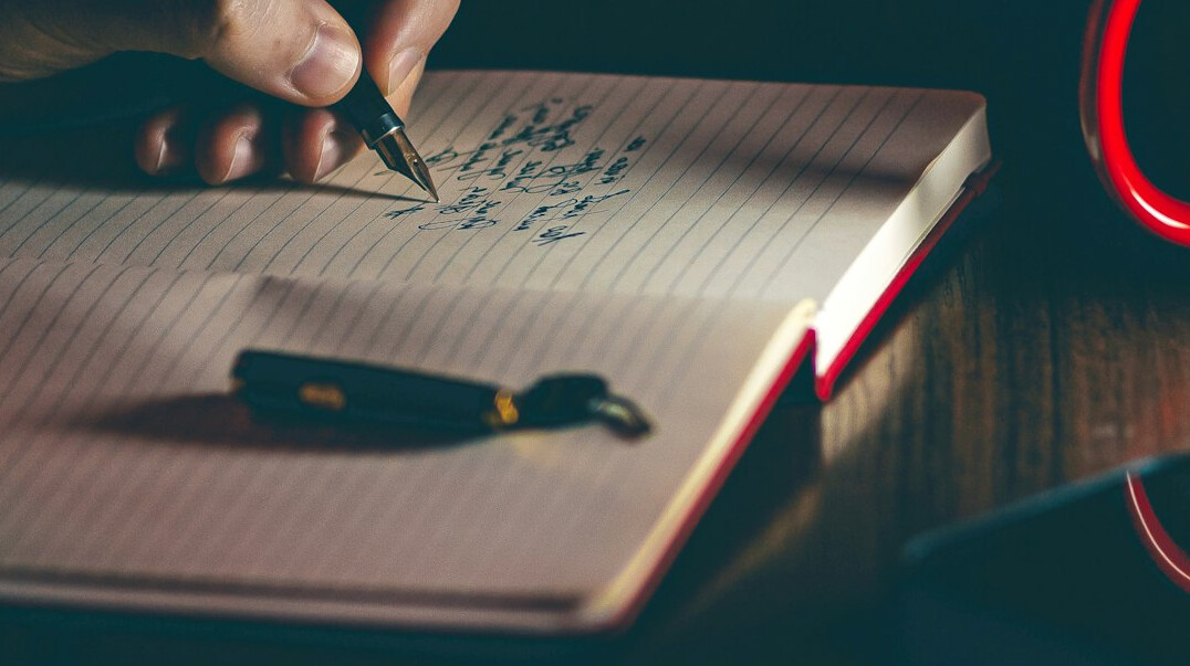 writer planning plot on paper